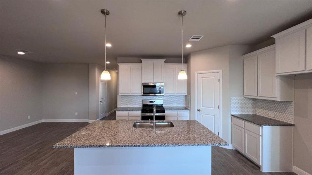 Kitchen- All Home and community information, including pricing, included features, terms, availability and amenities, are subject to change at any time without notice or obligation. All Drawings, pictures, photographs, video, square footages, floor plans, elevations, features, colors and sizes are approximate for illustration purposes only and will vary from the homes as built.