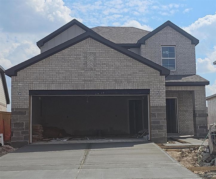 Front exterior of a new home in Creekland Village at Bridgeland, Cypress, TX, highlighting curb appeal (Image 2).