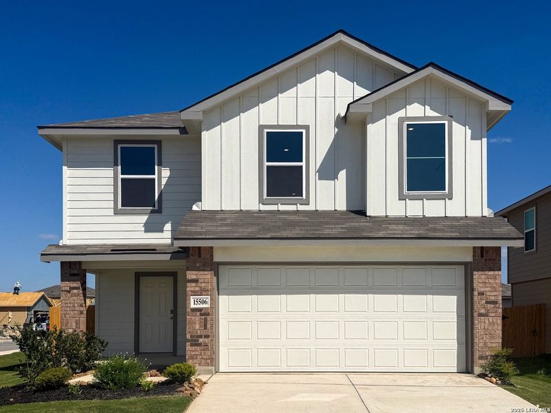 Front exterior of a new home in Preserve at Medina, Von Ormy, TX, highlighting curb appeal (Image 2).