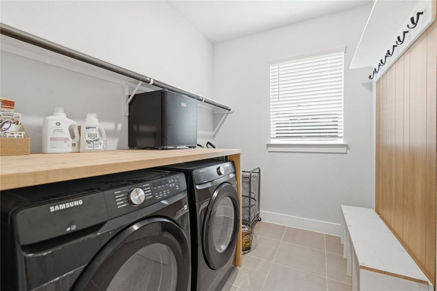 A well-appointed laundry room with built-in