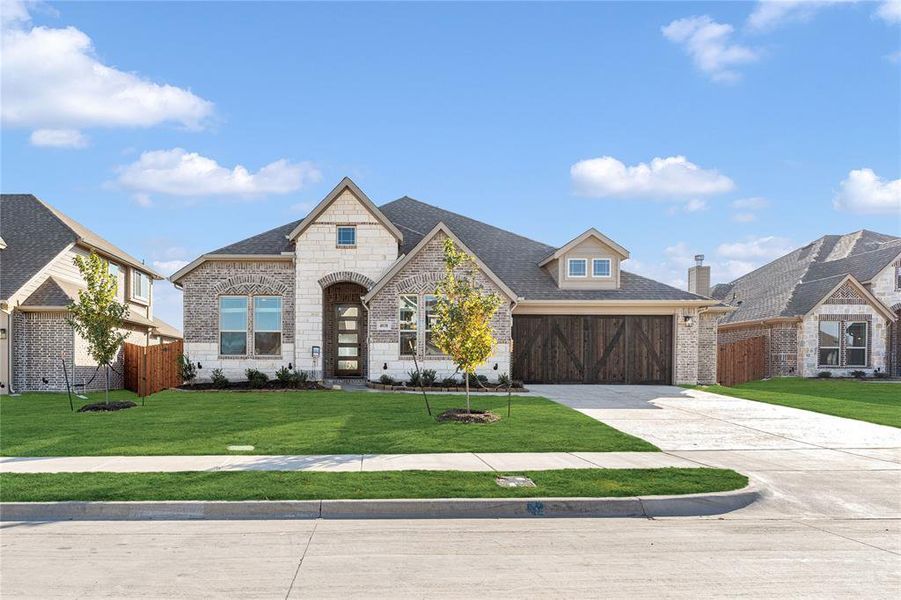 Front exterior of a new home in Villages of Walnut Grove, Midlothian, TX, highlighting curb appeal (Image 22).