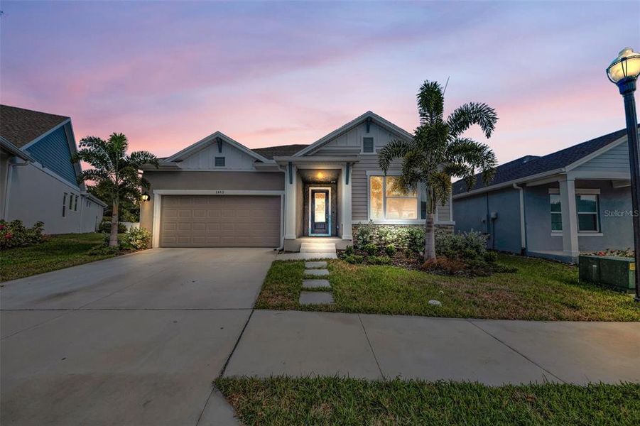 Front exterior of a new home in Eagle Creek - Garden Series, Tarpon Springs, FL, highlighting curb appeal (Image 19).