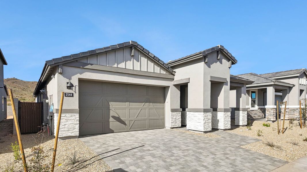 Representative exterior photo of a completed home built from the Hayden by D.R. Horton in The Ridge at Stone Butte, Phoenix, AZ (Image 24).