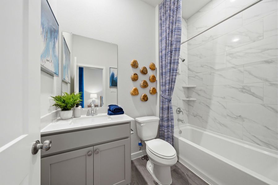 A bathroom with a shower and toilet. A bathroom with a shower and toilet.