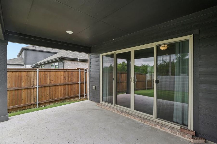 Exterior details and patio area of a home in Lakehaven - Signature Series, Farmersville (Image 23). Exterior details and patio area of a home in Lakehaven - Signature Series, Farmersville (Image 23).