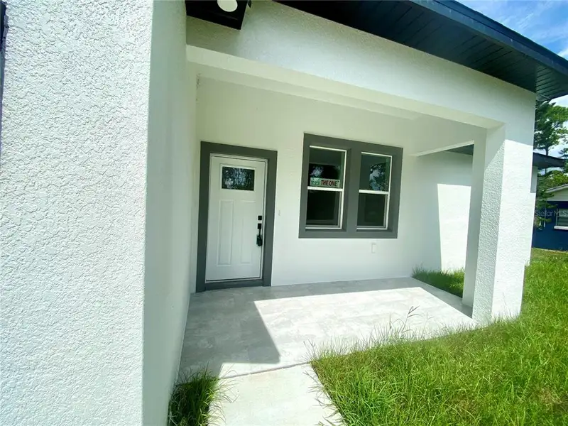 Exterior details and patio area of a home in , Sebring (Image 3).