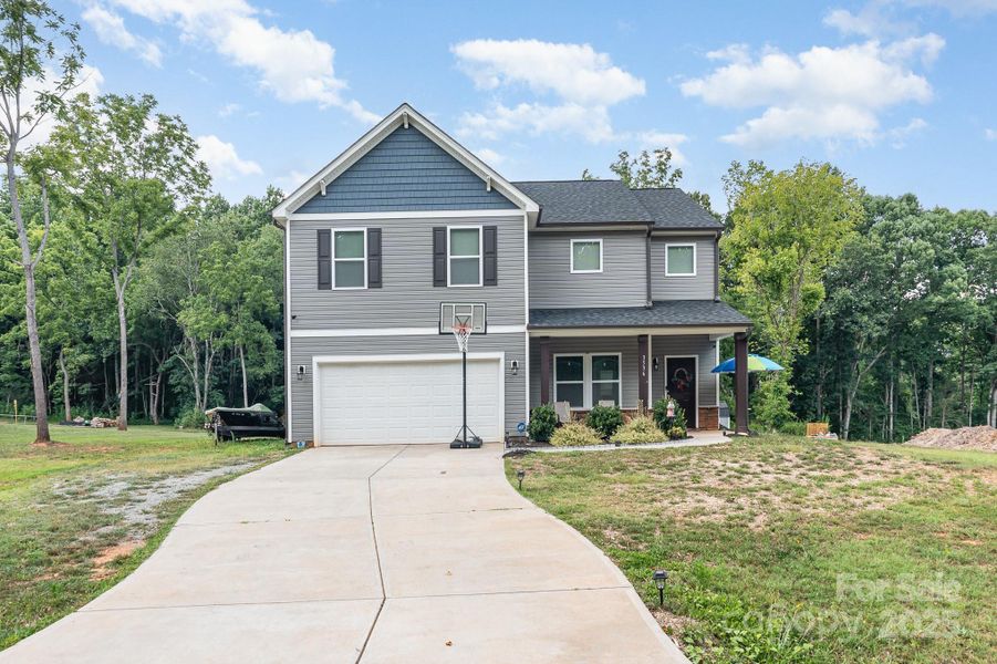 Front exterior of a new home in , Gastonia, NC, highlighting curb appeal (Image 20). Front exterior of a new home in , Gastonia, NC, highlighting curb appeal (Image 20).