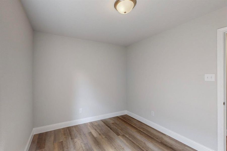 Empty room featuring light wood-type flooring