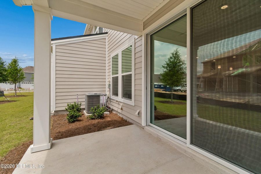 Exterior details and patio area of a home in Westerly Park at Wildlight – Overlook Collection, Yulee (Image 2). Exterior details and patio area of a home in Westerly Park at Wildlight – Overlook Collection, Yulee (Image 2).