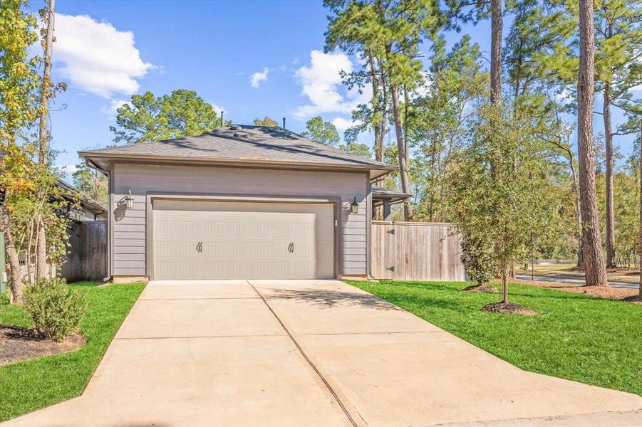 Rear garage entry with nice sized driveway to park extra cars or guests