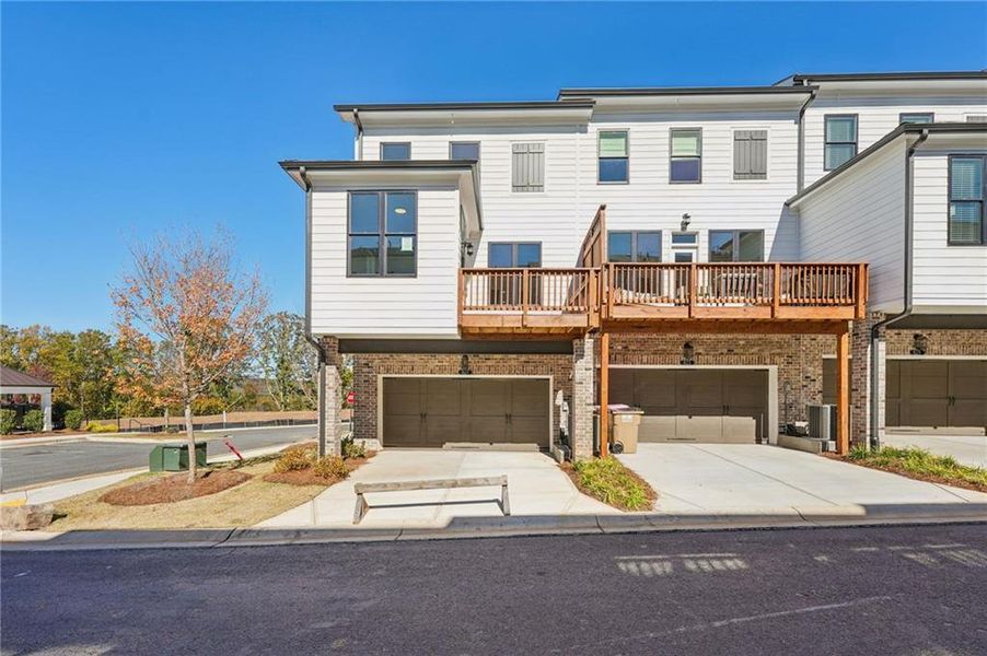 Front exterior of a new home in Palisades Townhomes, Cumming, GA, highlighting curb appeal (Image 24).