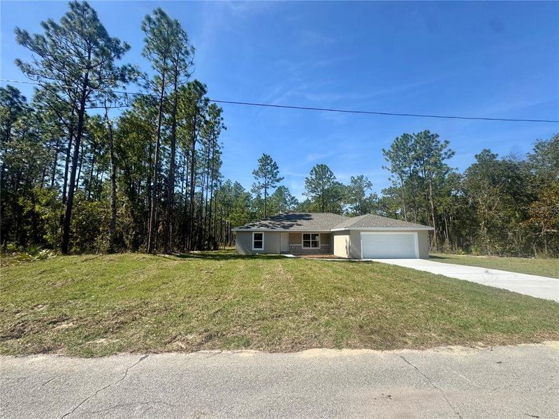 Front exterior of a new home in , Ocala, FL, highlighting curb appeal (Image 1). Front exterior of a new home in , Ocala, FL, highlighting curb appeal (Image 1).