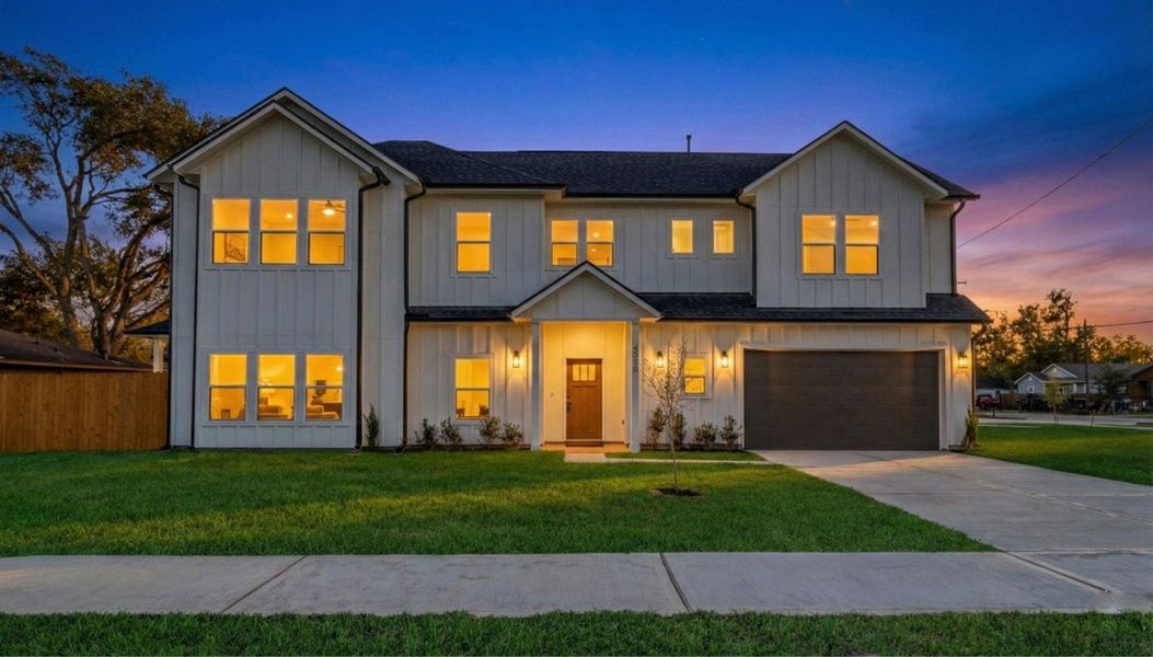 Stunning new construction with modern farmhouse design, showcased beautifully at dusk. Warm interior lighting highlights the inviting curb appeal. Stunning new construction with modern farmhouse design, showcased beautifully at dusk. Warm interior lighting highlights the inviting curb appeal.