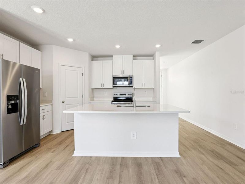 Furnished interior view inside a new home in Hilltop Vistas, Dade City (Image 11).