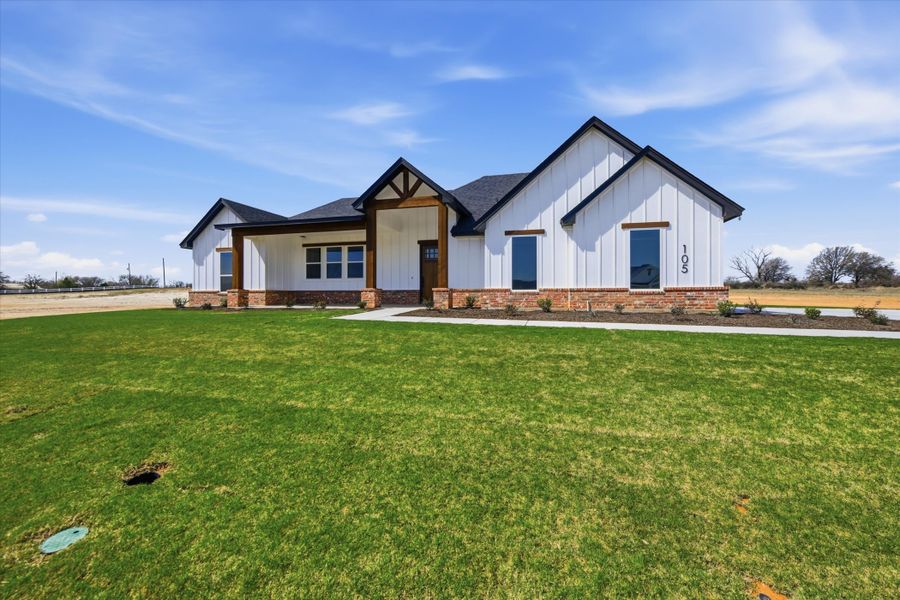 Front exterior of a new home in Zion Valley, Poolville, TX, highlighting curb appeal (Image 22).