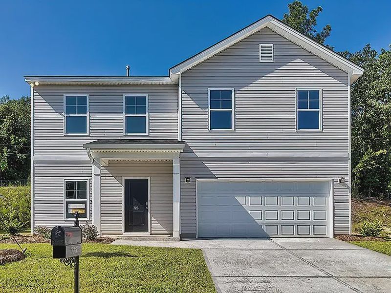 Front exterior of a new home in Emanuel Creek, West Columbia, SC, highlighting curb appeal (Image 1). Front exterior of a new home in Emanuel Creek, West Columbia, SC, highlighting curb appeal (Image 1).