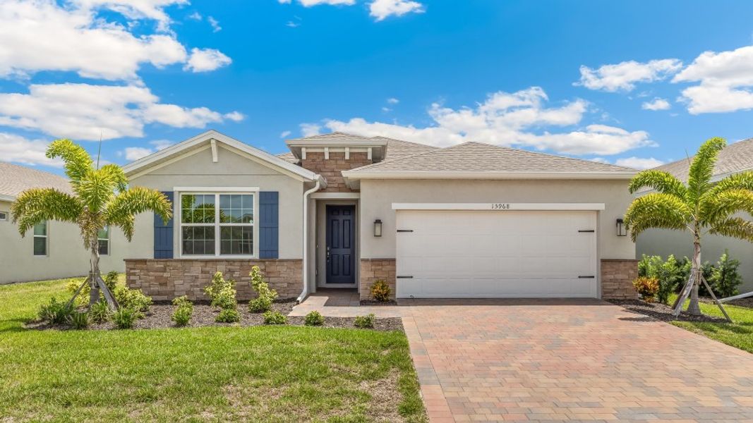 Front exterior of a new home in Palmetto Landing at Babcock Ranch, Punta Gorda, FL, highlighting curb appeal (Image 1). Front exterior of a new home in Palmetto Landing at Babcock Ranch, Punta Gorda, FL, highlighting curb appeal (Image 1).