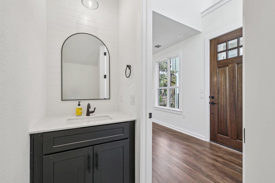Bathroom with vanity and dark wood finished floors