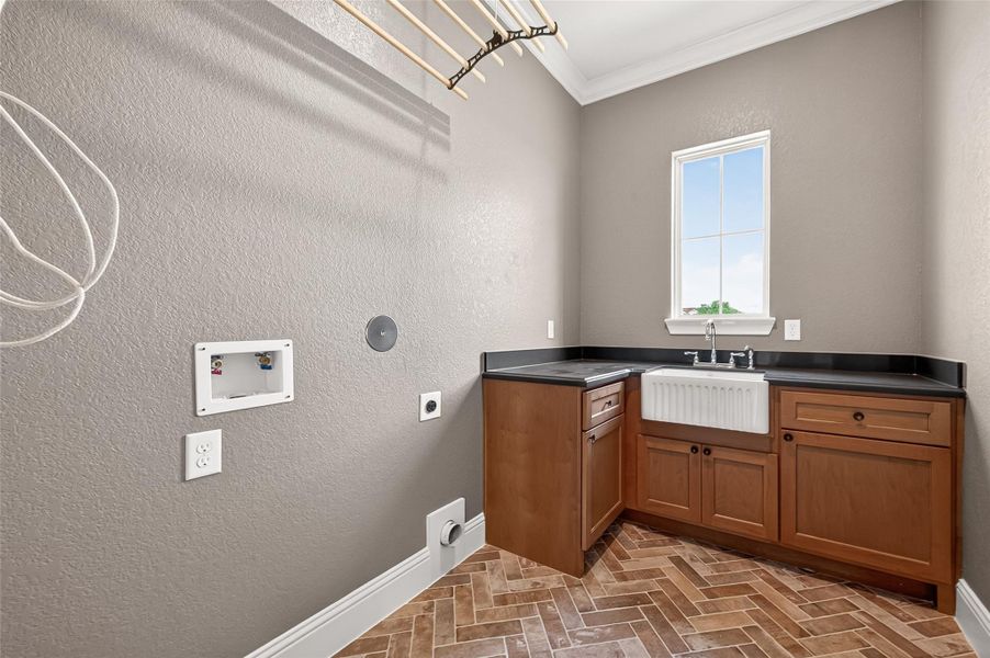 Laundry room downstairs right off of the door to the garage.