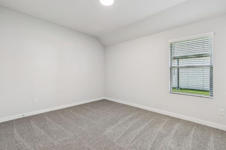 Bedroom in the Oscar home plan by Trophy Signature Homes – REPRESENTATIVE PHOTO