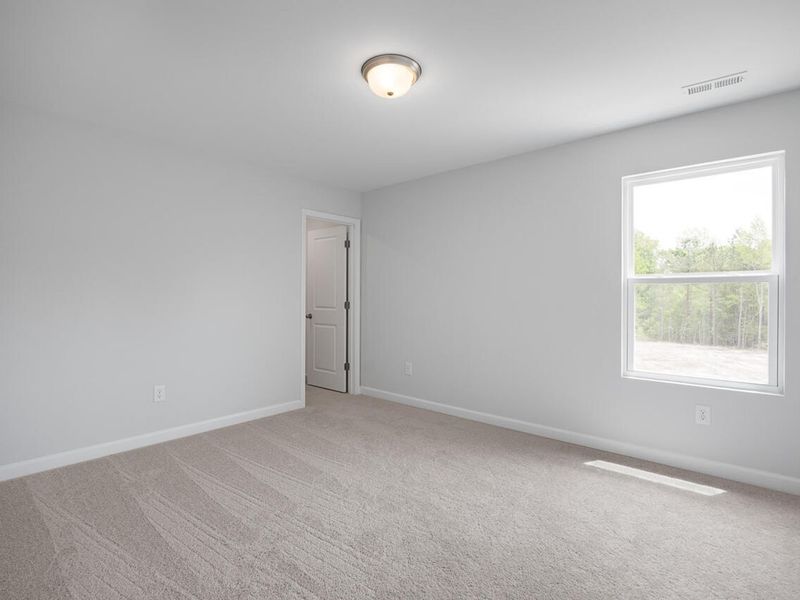 Spacious, unfurnished interior of a new home in Woodland Crossing, Zebulon (Image 19).