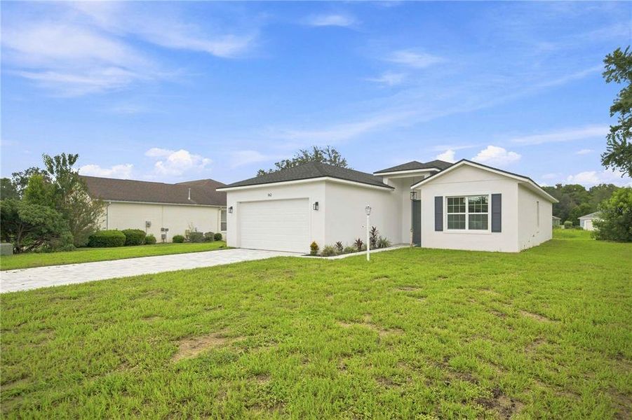 Front exterior of a new home in , Beverly Hills, FL, highlighting curb appeal (Image 25).