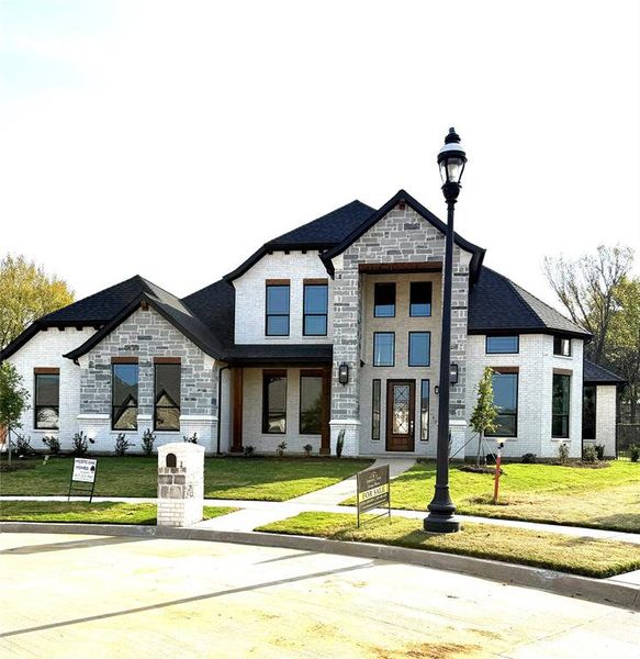 Front exterior of a new home in , Arlington, TX, highlighting curb appeal (Image 1). Front exterior of a new home in , Arlington, TX, highlighting curb appeal (Image 1).