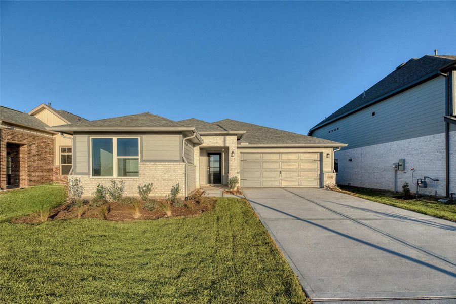 Front exterior of a new home in Aldeana - Paintbrush Collection, Bonney, TX, highlighting curb appeal (Image 2). Front exterior of a new home in Aldeana - Paintbrush Collection, Bonney, TX, highlighting curb appeal (Image 2).