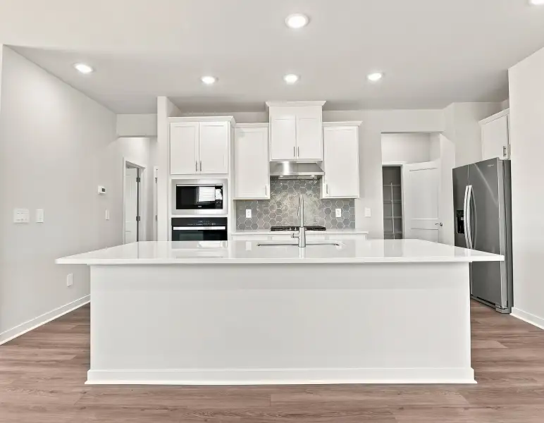 Furnished interior view inside a new home in Country Lane - Classic Series, Clayton (Image 3).