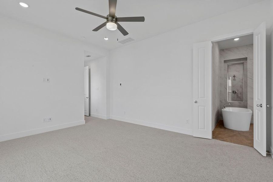 Unfurnished bedroom with recessed lighting, visible vents, light colored carpet, and baseboards Unfurnished bedroom with recessed lighting, visible vents, light colored carpet, and baseboards