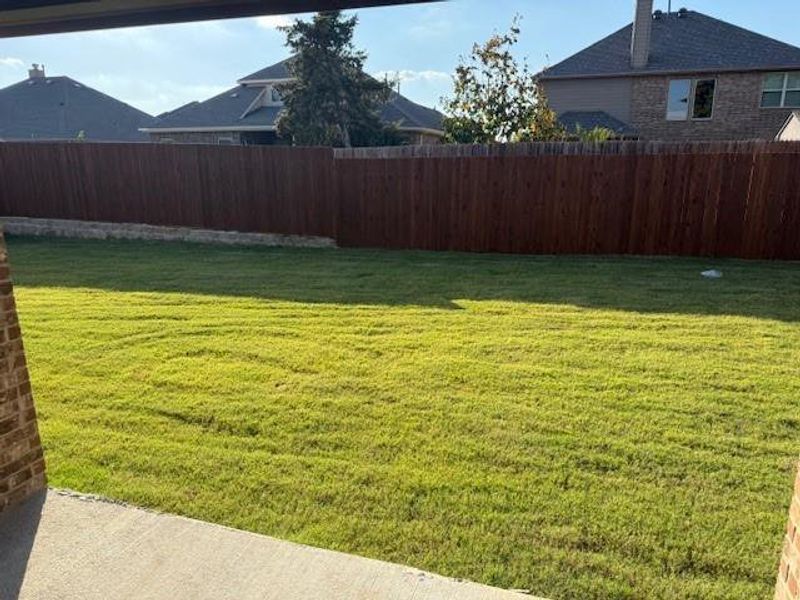 Exterior details and patio area of a home in Fireside by the Lake, Garland (Image 3).