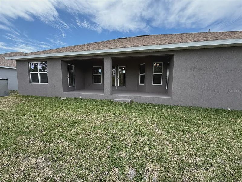 Front exterior of a new home in South Gulf Cove, Port Charlotte, FL, highlighting curb appeal (Image 12). Front exterior of a new home in South Gulf Cove, Port Charlotte, FL, highlighting curb appeal (Image 12).
