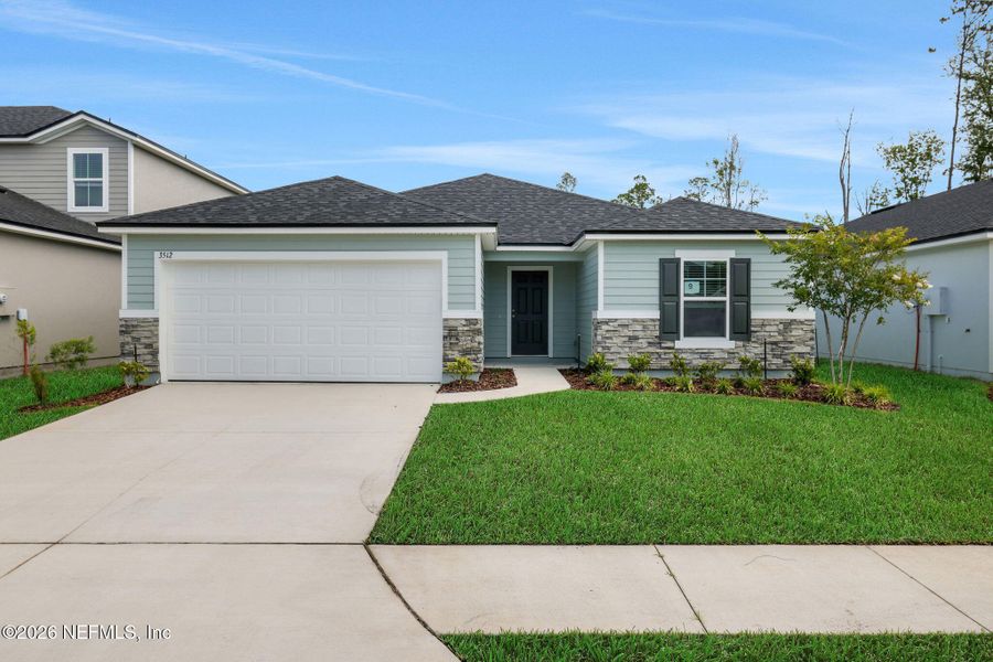 Front exterior of a new home in Wilford Oaks, Orange Park, FL, highlighting curb appeal (Image 21). Front exterior of a new home in Wilford Oaks, Orange Park, FL, highlighting curb appeal (Image 21).
