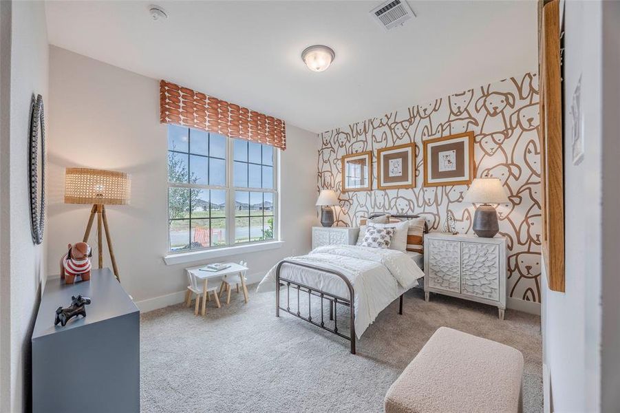 Bedroom with light colored carpet