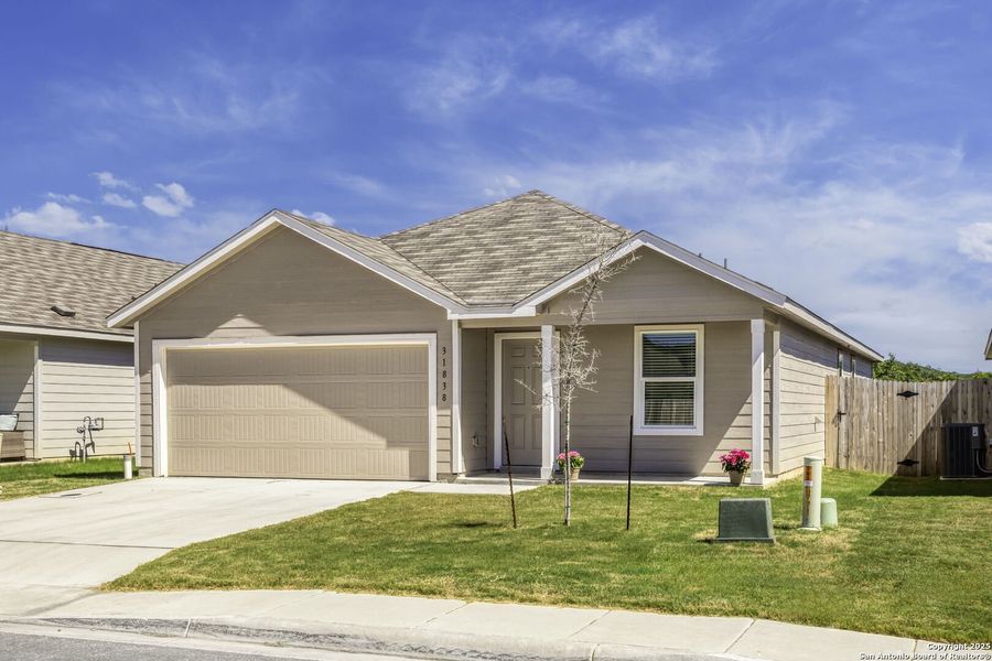 Front exterior of a new home in , Bulverde, TX, highlighting curb appeal (Image 1).