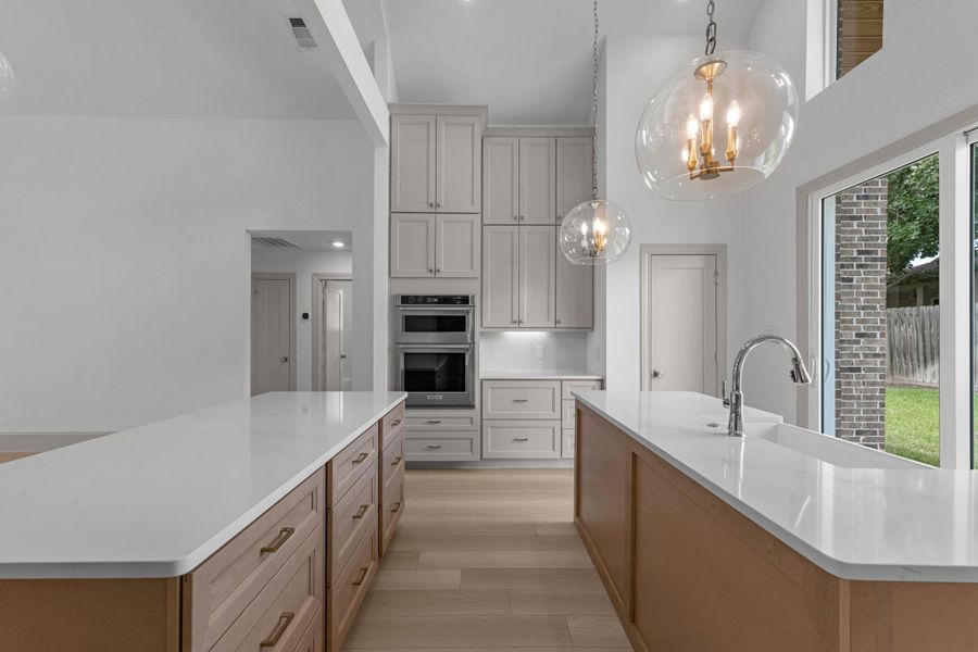 The primary retreat is expansive and features touches such as a tray ceiling and recessed lighting. Virtually staged to show furniture placement. The primary retreat is expansive and features touches such as a tray ceiling and recessed lighting. Virtually staged to show furniture placement.