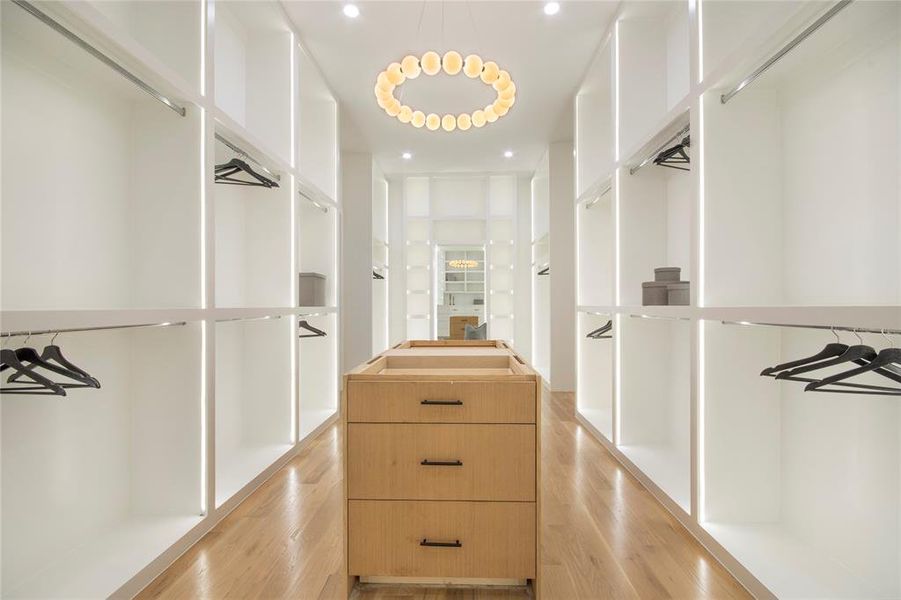 Walk in closet featuring light wood-style floors