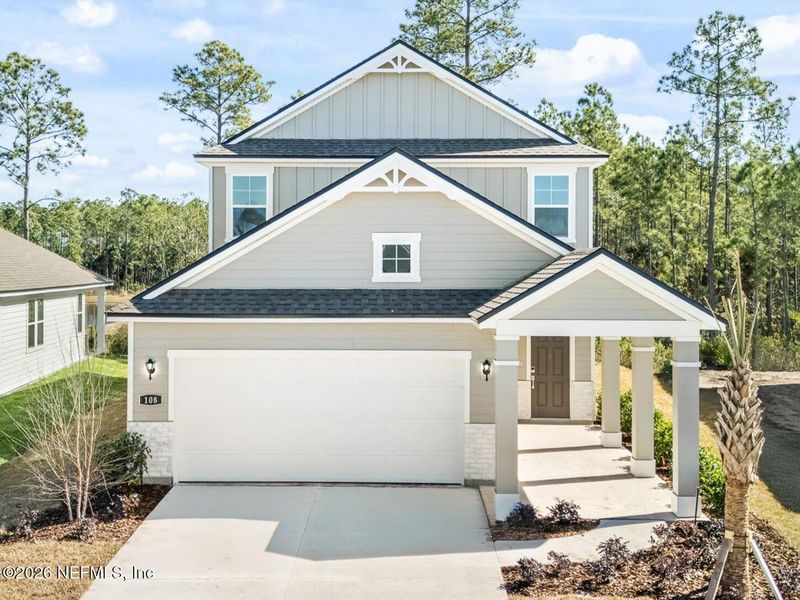 Front exterior of a new home in Seminole Palms, Palm Coast, FL, highlighting curb appeal (Image 1). Front exterior of a new home in Seminole Palms, Palm Coast, FL, highlighting curb appeal (Image 1).