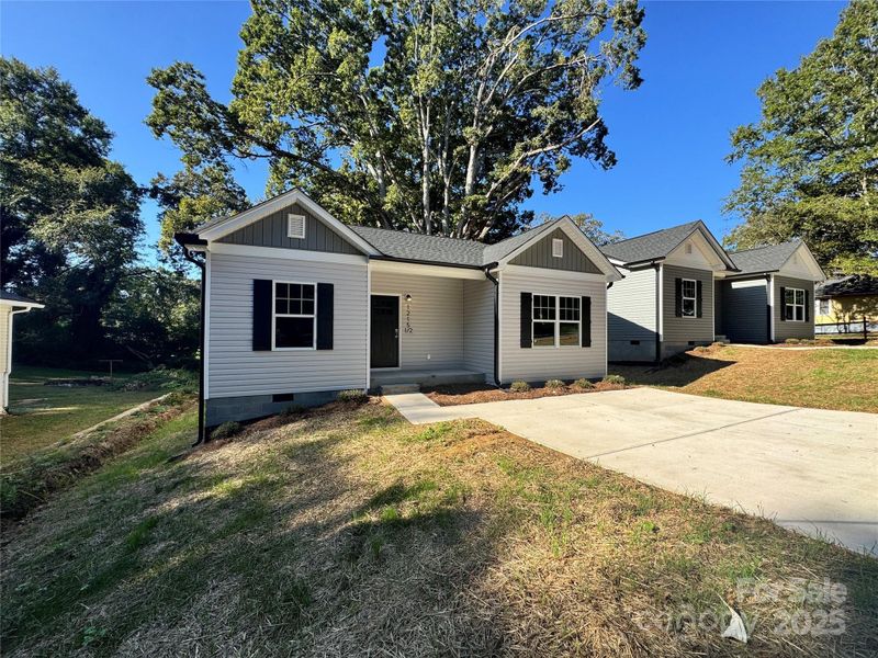 Front exterior of a new home in , Gastonia, NC, highlighting curb appeal (Image 1). Front exterior of a new home in , Gastonia, NC, highlighting curb appeal (Image 1).