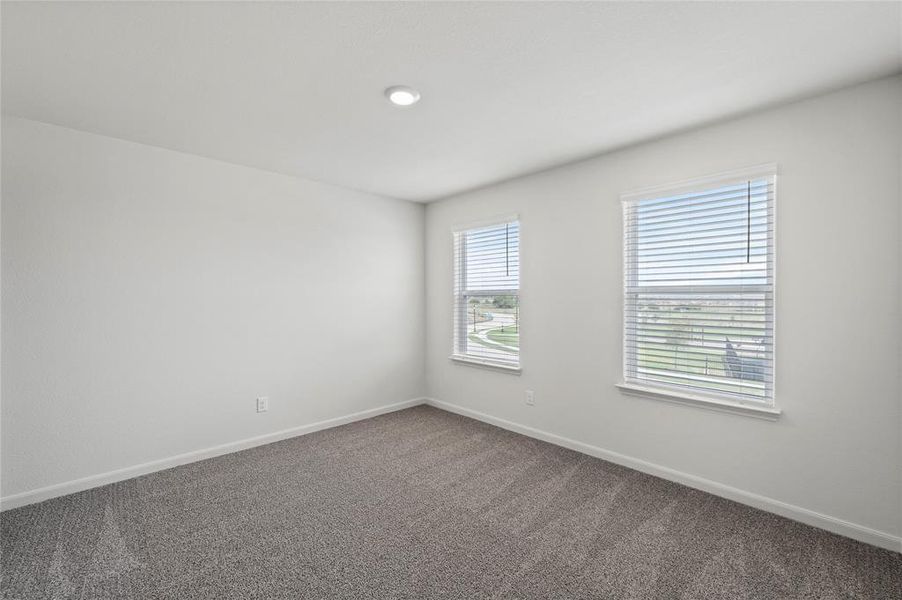 Empty room with baseboards and carpet