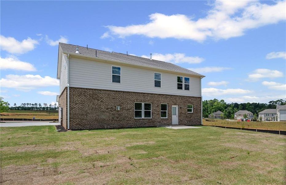 Front exterior of a new home in Anderson Point Estates, McDonough, GA, highlighting curb appeal (Image 2).