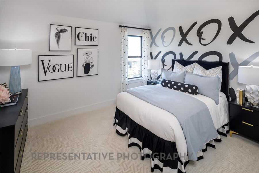 Bedroom featuring carpet flooring and baseboards