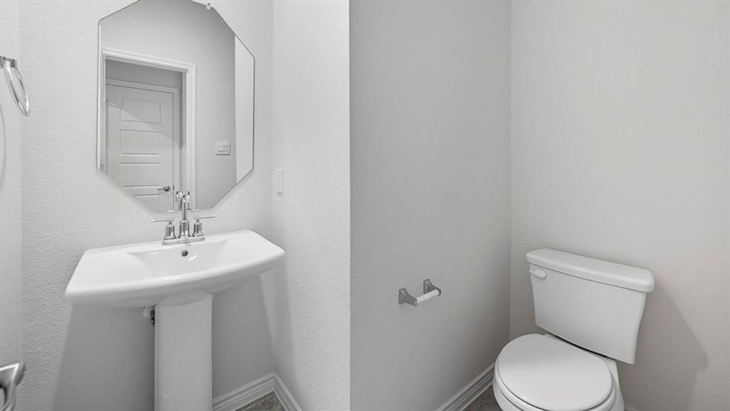 Half bathroom with baseboards Half bathroom with baseboards