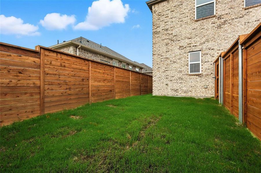 View of fenced backyard
