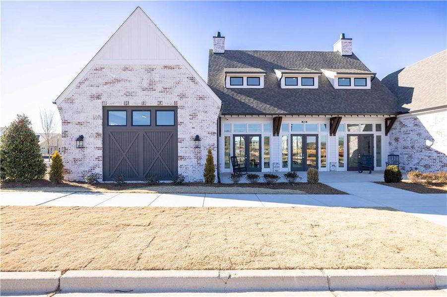 Front exterior of a new home in Promenade at Sawnee Village, Cumming, GA, highlighting curb appeal (Image 17).