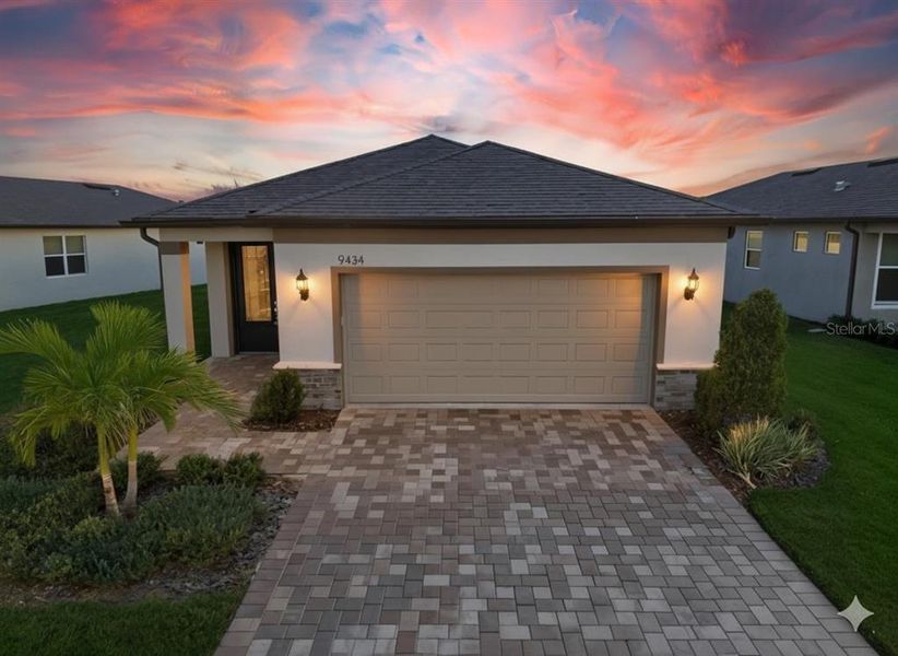 Front exterior of a new home in Del Webb BayView, Parrish, FL, highlighting curb appeal (Image 1). Front exterior of a new home in Del Webb BayView, Parrish, FL, highlighting curb appeal (Image 1).