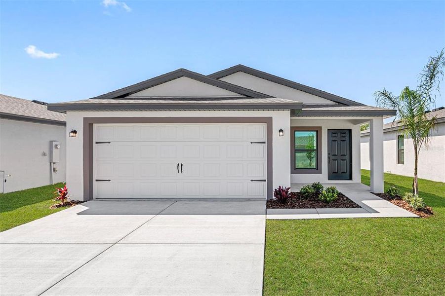 Front exterior of a new home in Spring Hill, Spring Hill, FL, highlighting curb appeal (Image 1). Front exterior of a new home in Spring Hill, Spring Hill, FL, highlighting curb appeal (Image 1).