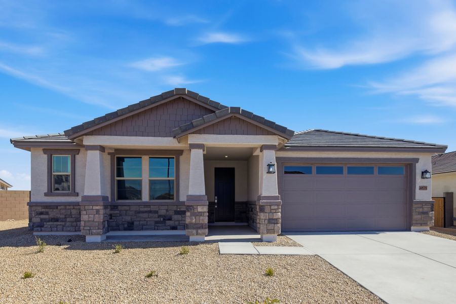 Front exterior of a new home in Montana Vista - Summit: Summit, Buckeye, AZ, highlighting curb appeal (Image 1). Front exterior of a new home in Montana Vista - Summit: Summit, Buckeye, AZ, highlighting curb appeal (Image 1).