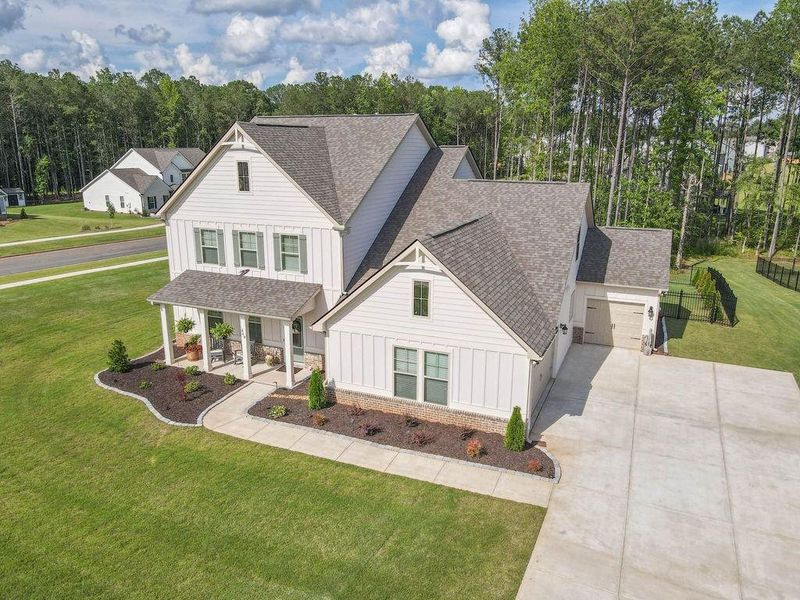 Front exterior of a new home in , Senoia, GA, highlighting curb appeal (Image 37). Front exterior of a new home in , Senoia, GA, highlighting curb appeal (Image 37).