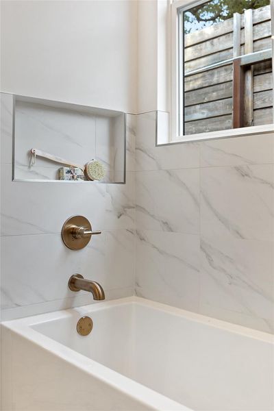 Bathroom featuring tub / shower combination